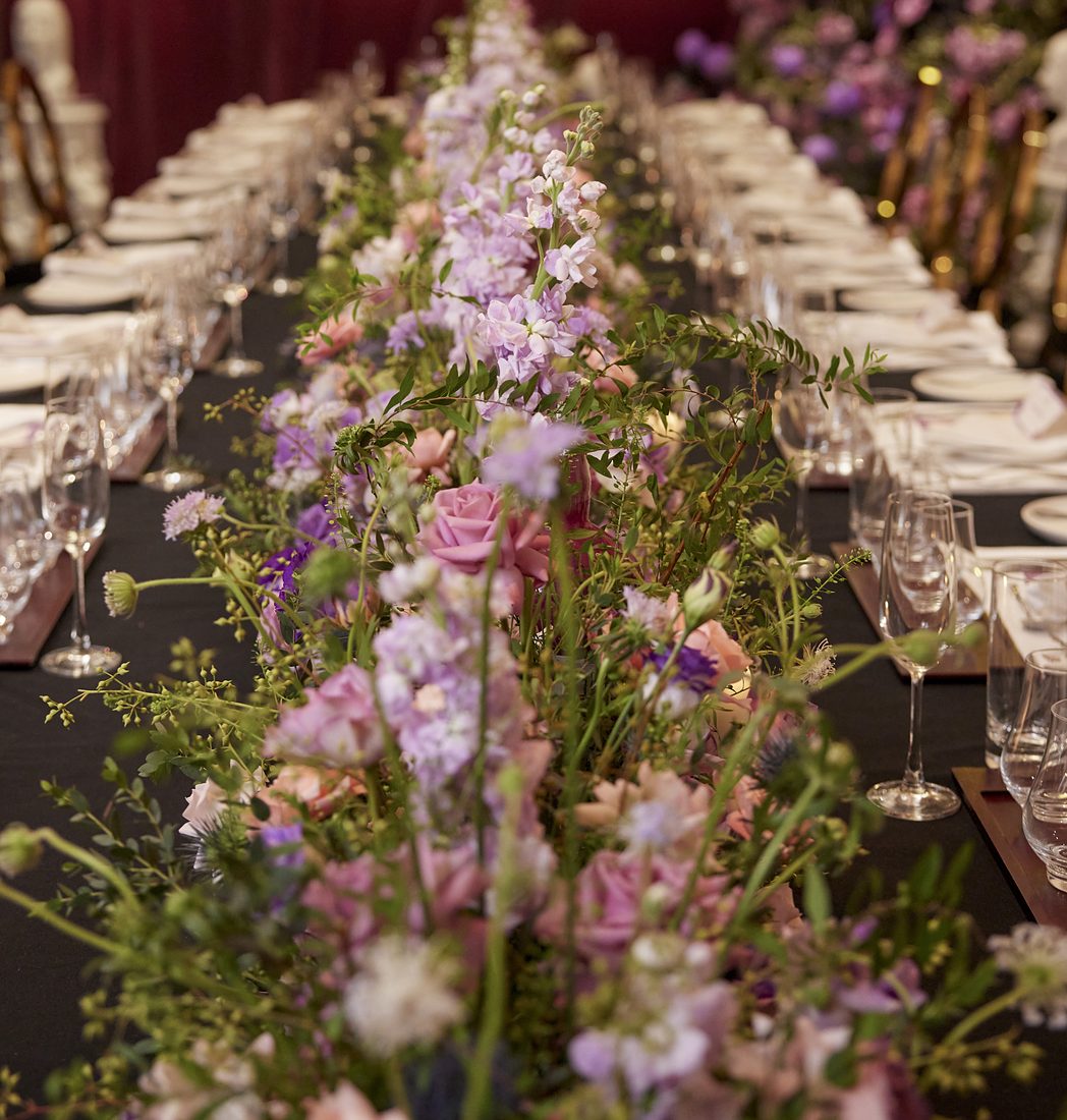 Flower runner and place settings at a VIP dinner